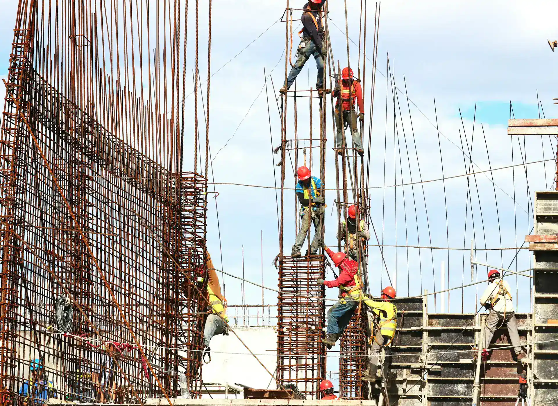 Workers on a reinforcement cage at height