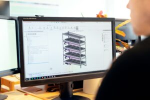 CAD technician working on detailed engineering drawings and production support tasks
